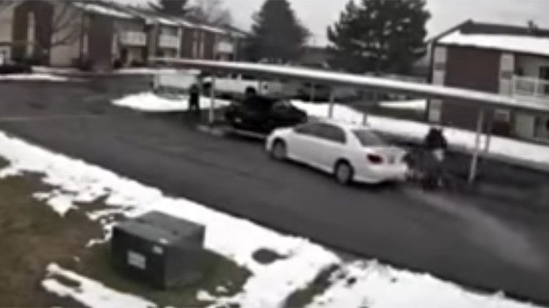 Dramatic video shows man stealing car with two young children inside