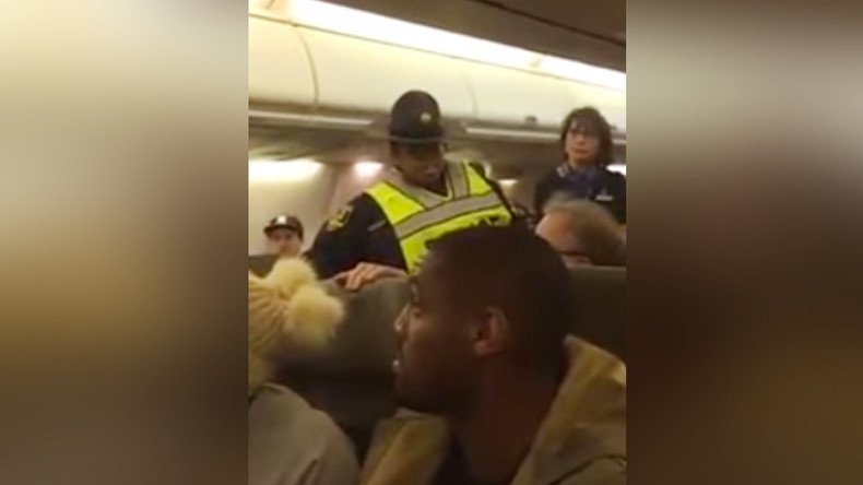 ‘You put his fingers on nuclear button’: Woman thrown off plane for berating Trump supporter (VIDEO)