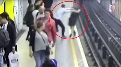 ‘I wasn’t sober’: Russian metro guard puts gun to head of ‘terrorist’ in middle of station (VIDEO)