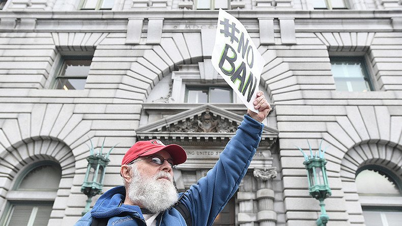 DOJ requests Seattle judge postpone further action on Trump’s travel ban