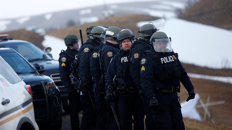 Riot police & military Humvees enter Standing Rock camp