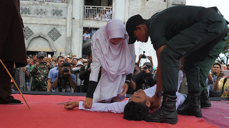 Indonesian man faints during caning, revived & caned again (PHOTOS)
