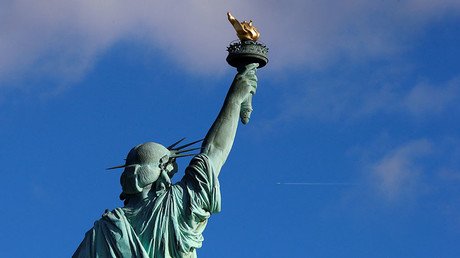 Activists hang ‘Refugees Welcome’ banner on Statue of Liberty