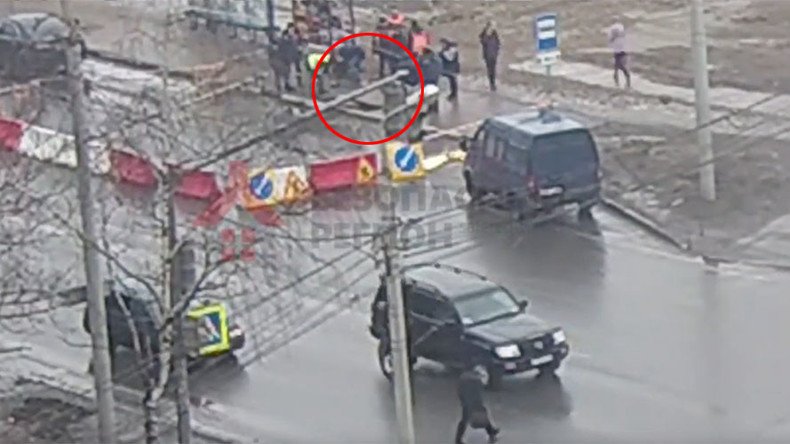 Russian road swallows man waiting for trolleybus (VIDEO)