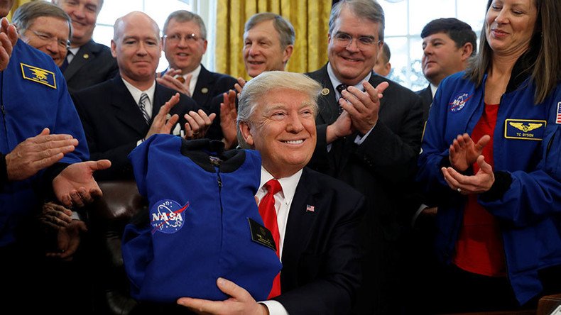 Trump signs NASA funding bill to send astronauts to Mars