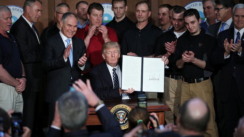 Trump revokes Obama climate change rules, declares end to ‘war on coal’