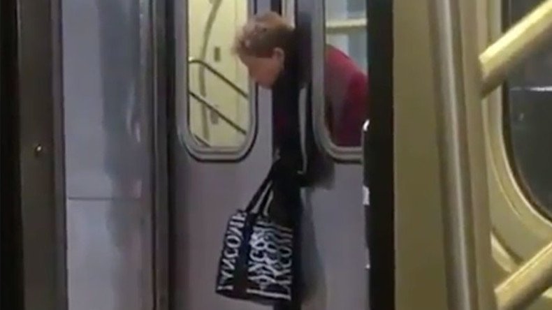 ‘New York state of mind’: Passengers filmed ignoring woman with head stuck in subway doors (VIDEO)