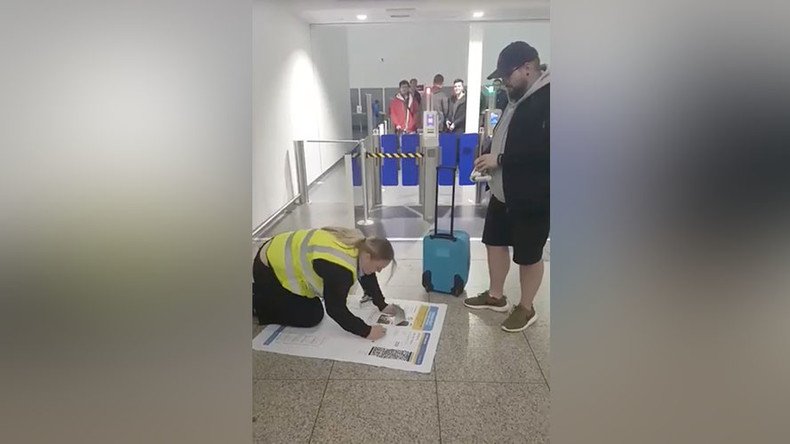 Practical joker tries to get on flight with massive boarding pass (VIDEO)
