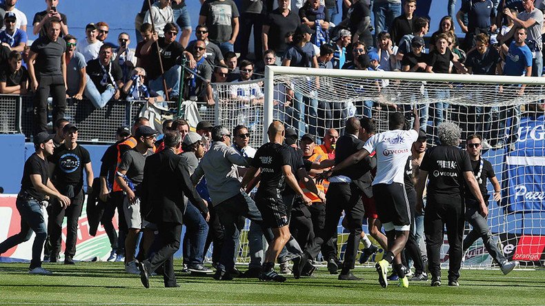 Bastia v Lyon match abandoned in France after fans invade pitch and attack players (VIDEO)