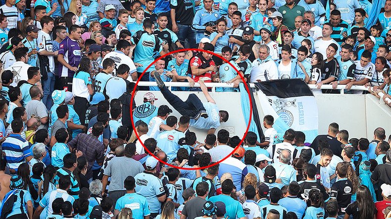 Argentine football fan dies after being mistaken for rival supporter & chased from stands (VIDEO)