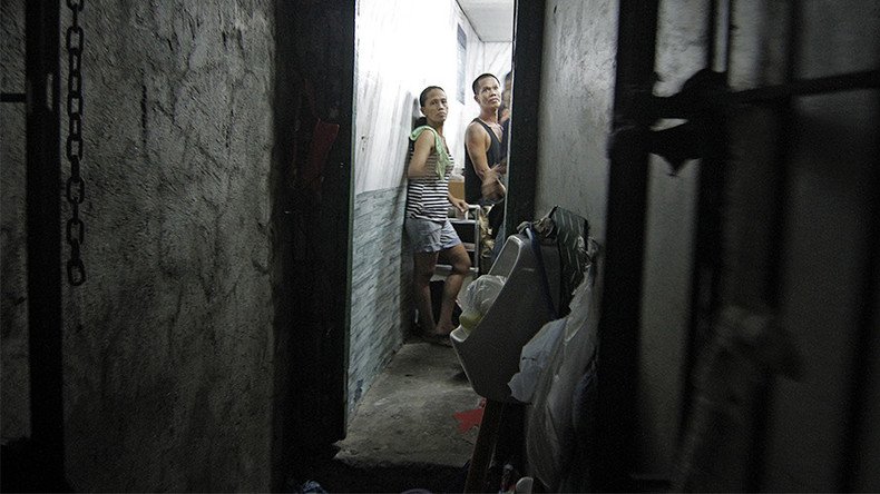 ‘Begging for water’: Secret cell behind bookshelf exposed at Philippines police station (PHOTOS)