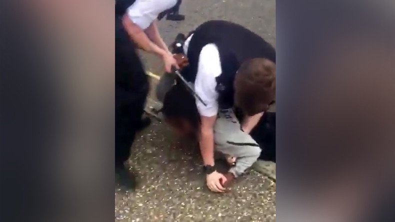 Police pin teen to ground, beat him with baton in shocking footage (VIDEO)