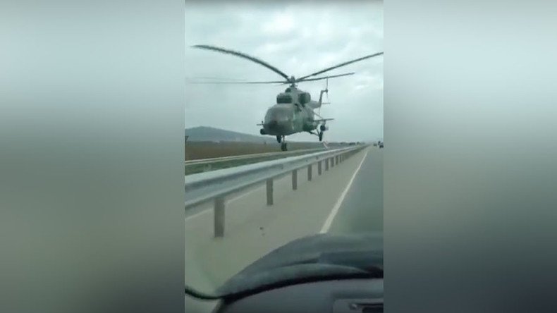 Chopper buzzes Chechen highway, narrowly avoids collision with vehicle (VIDEO)