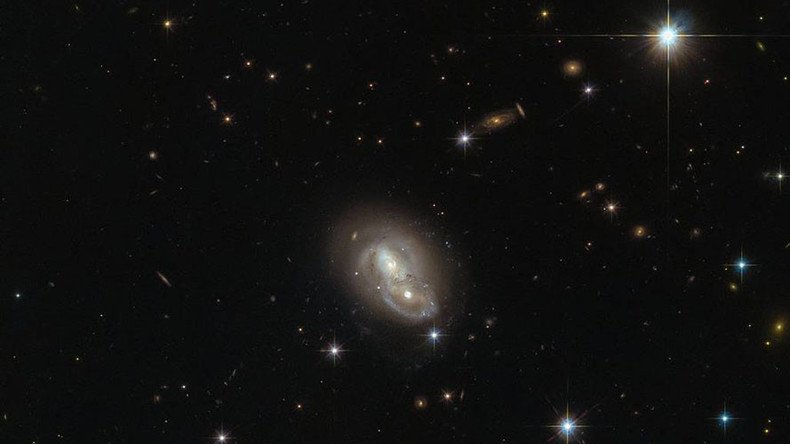 Hubble snaps 2 galaxies hurtling past each other at over a million mph (PHOTO)