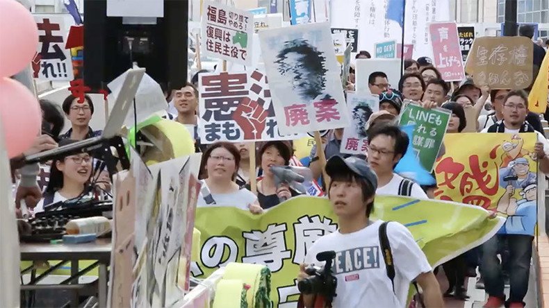 100s of students march in Tokyo against Japanese PM Abe’s plans to change pacifist constitution