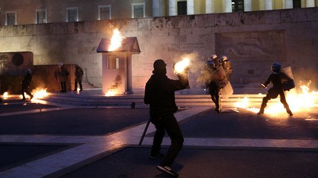 Greek parliament passes austerity cuts as Molotov-throwing protesters clash with police in Athens