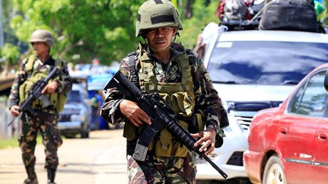 Gunmen take priest, churchgoers hostage in Philippines, vow to kill captives 