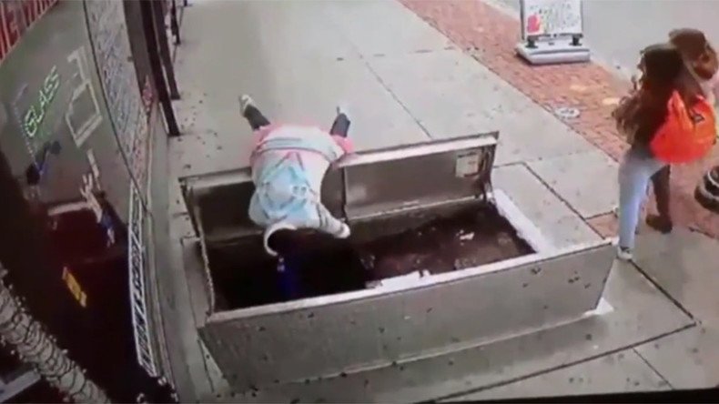 Woman distracted by phone tumbles through sidewalk trapdoor in horror fall (VIDEO)