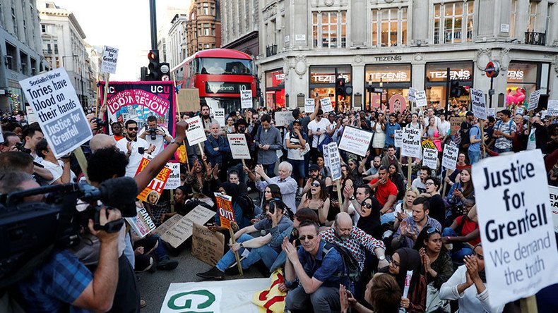 Ruptly producer attacked & violently kicked at Grenfell fire protest in London