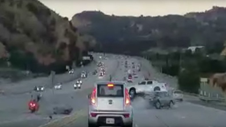 Highway road rage leads to fiery wreck after motorcyclist kicks car (VIDEO)