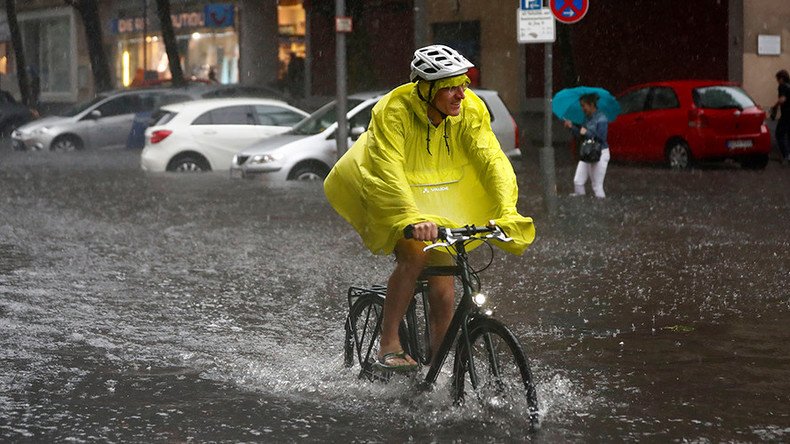 Monster storm batters Berlin: Cyclists persevere, surfers thrive (VIDEOS PHOTOS)