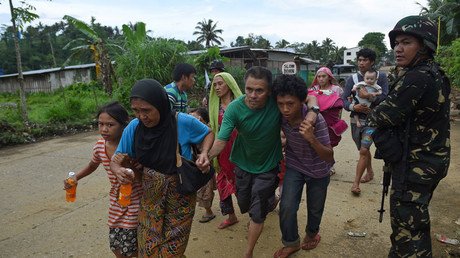 ‘We lost everything’: Civilians fleeing ISIS-besieged Philippines city talk to RT