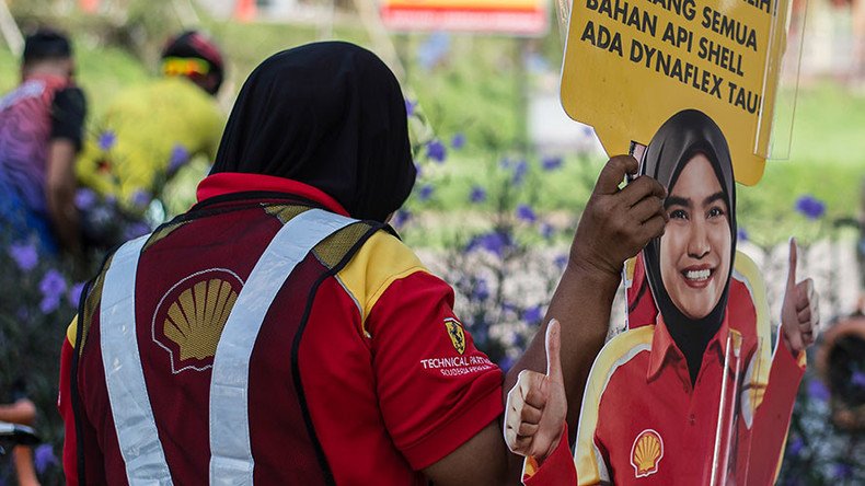 Shell recalls cardboard cutouts of female employee after groping pics emerge (PHOTOS)