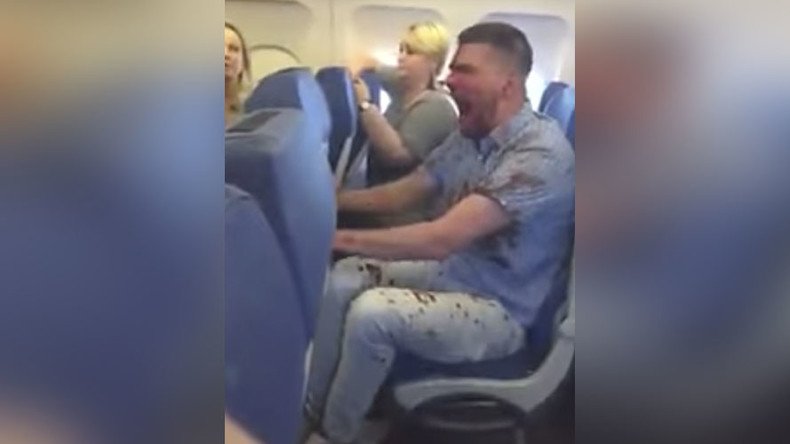 Bloodied man tied up by passengers after fear of flying leads to extreme drunkenness (VIDEOS)