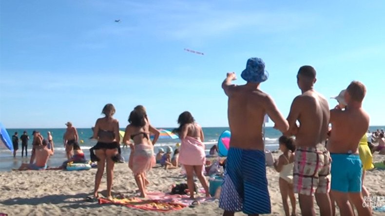 ‘Go home f***ing tourists’: Insulting plane banner targets beachgoers in France