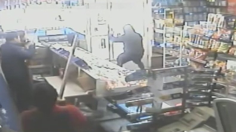Armed shopkeepers chase attempted robber out of store (VIDEO)