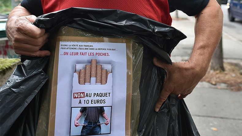 French tobacconists protest govt plan to raise cigarette prices