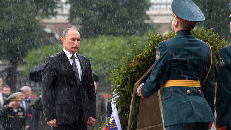 ‘Not made of sugar’: Putin shrugs off badass downpour pic