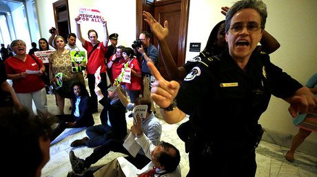 ‘Hands off our healthcare’ – Dozens arrested at Capitol Hill protest over GOP tax bill