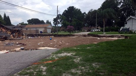 Enormous sinkhole devours two homes, threatens Florida neighborhood