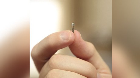 Handy way to pay: US firm plans to fit employees with microchip implants 