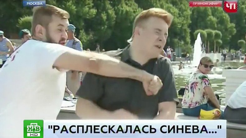 Rowdy Moscow reveler ruins live report by punching correspondent in the face (VIDEO)