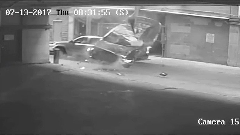 Car plunges 7 stories through barrier of parking lot (VIDEO)