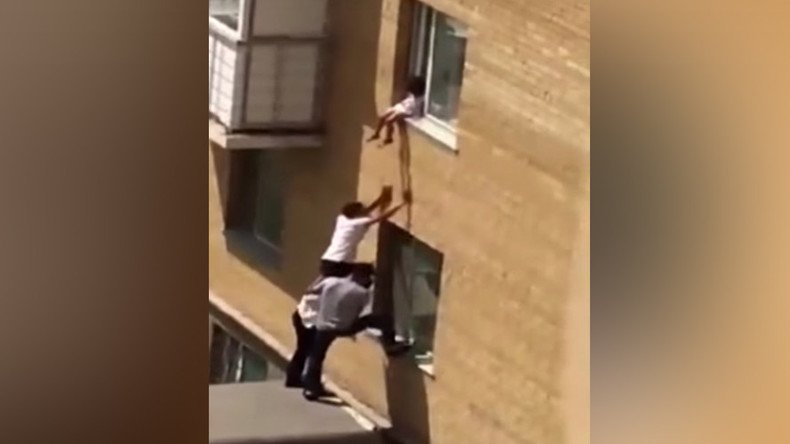 3 men form human pyramid to save toddler from perilous fall (VIDEO)