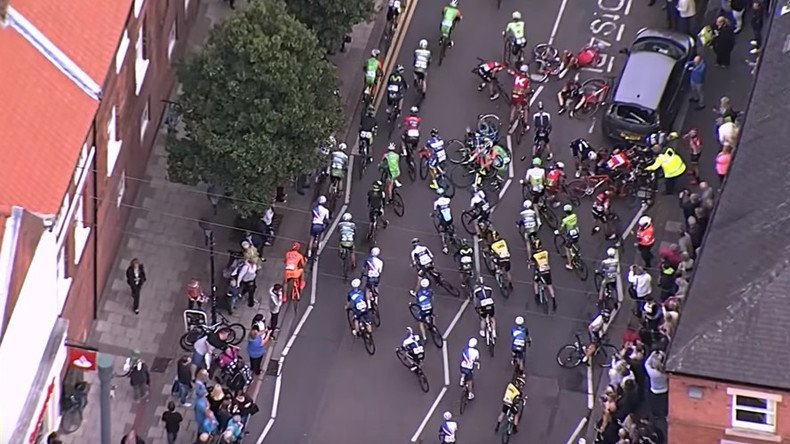 Parked car leads to mass crash at Tour of Britain cycle race (VIDEO)