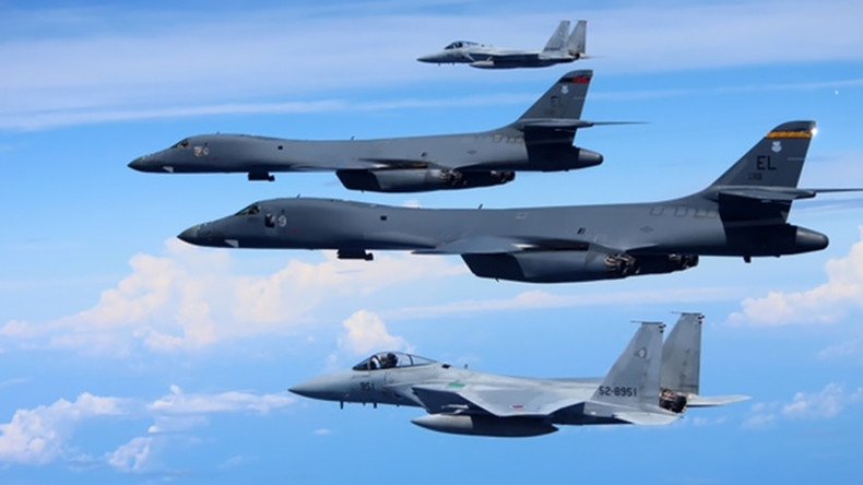 Japanese jet fighters & US bombers conduct war games over East China Sea