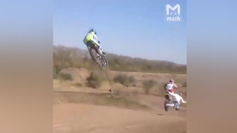 Fan dies after being hit by motocross bike while attempting to run across track (VIDEO)