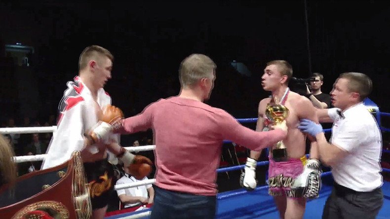 Kickboxer attacks opponent after losing, chases angry fan (VIDEO)