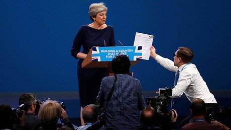 P45 prank, coughing fit & stage malfunction turn May’s keynote speech into living nightmare (VIDEO)