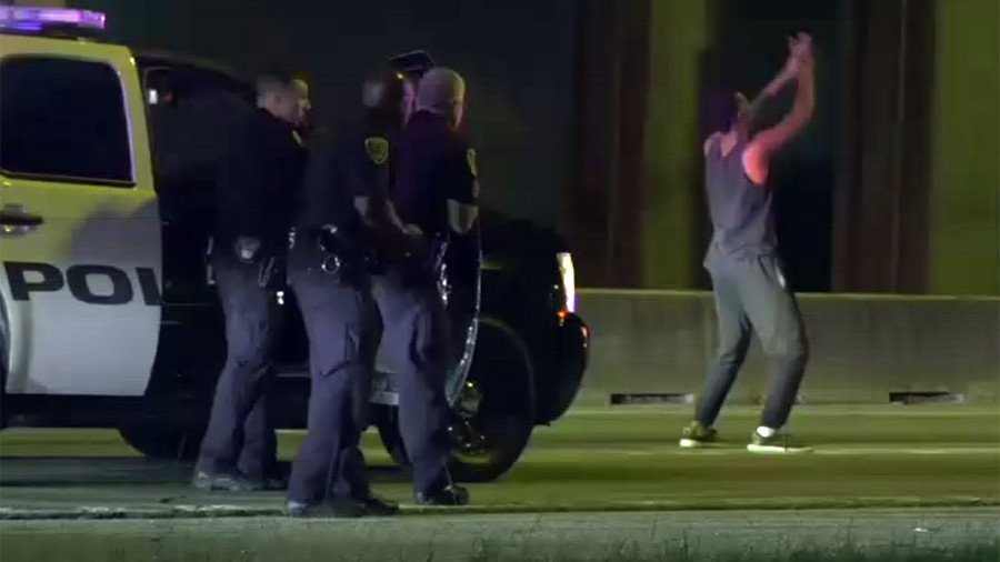 Bust a move: Man breaks into dance as puzzled police try to arrest him (VIDEO)