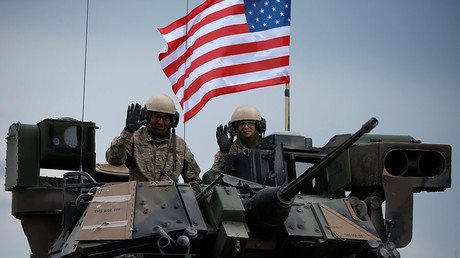 Troops, toys & threats: Trump signs $700bn military funding bill