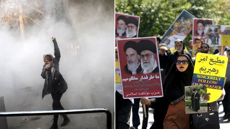 ‘West focuses only on anti-govt rallies’: Thousands protest for & against authorities in Iran