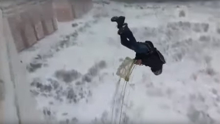 Russian daredevil jumps off high-rise in nail-biting video (VIDEO)