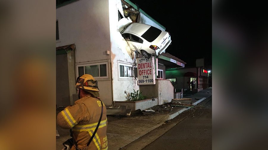 Speeding car takes flight, plows into 2nd floor of office building (PHOTOS)