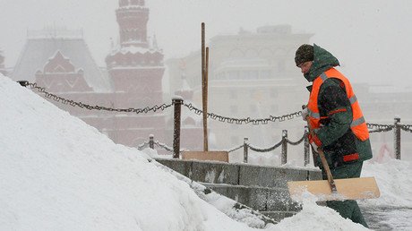 Paramotored skier takes to snowy Catalan streets as Europe is hit by freak blizzards (VIDEO)