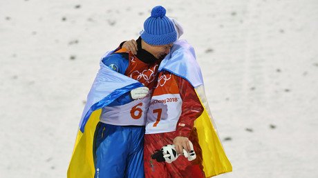 Olympic spirit: Ukrainian & Russian athletes embrace on Olympic podium